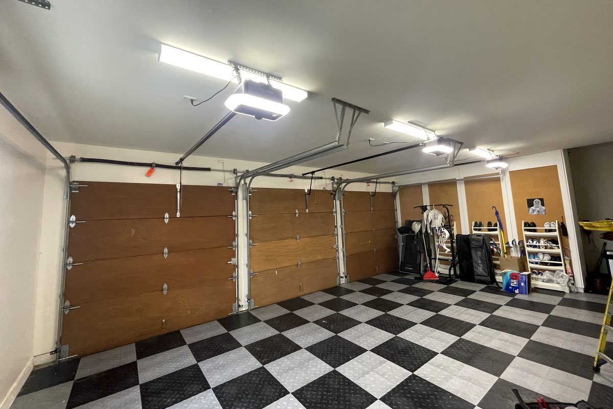 LiftMaster garage door opener installed above a two-car garage