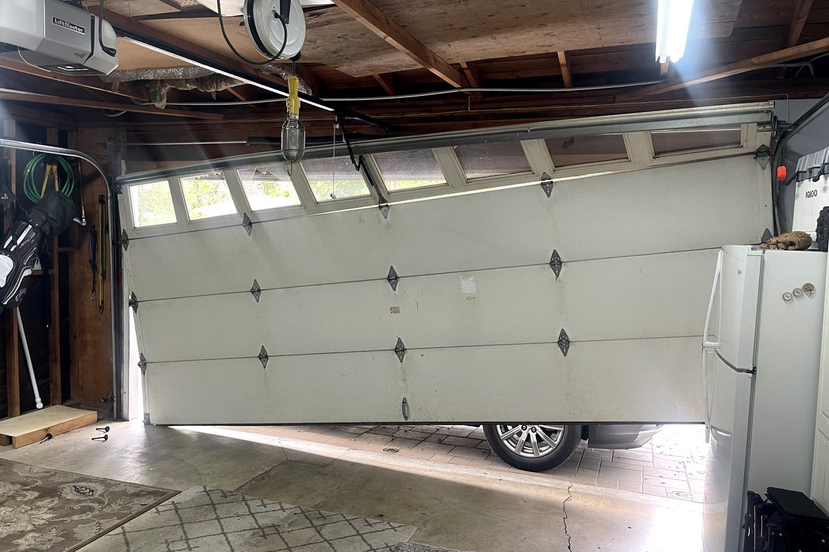 White sectional garage door repaired and reinstalled on a Southern California home